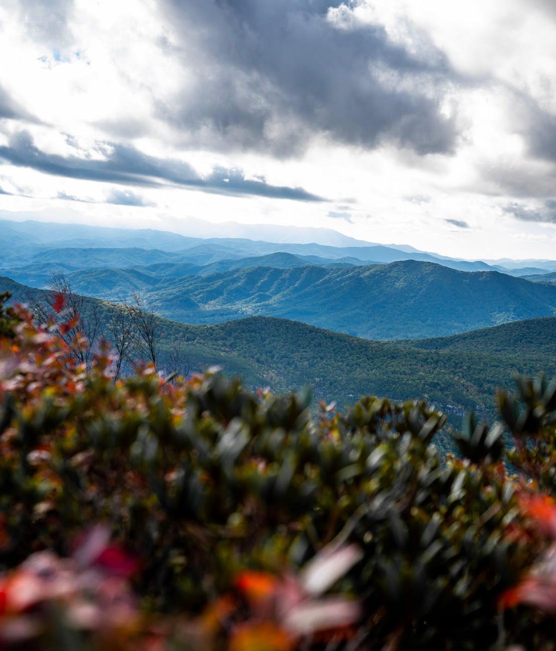 green mountain under white clouds